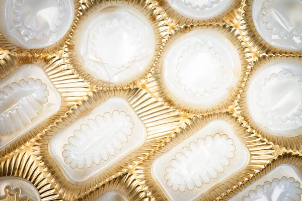Close Shot Empty Box Chocolates Shiny Gold Plastic Texture Empy — Fotografia de Stock