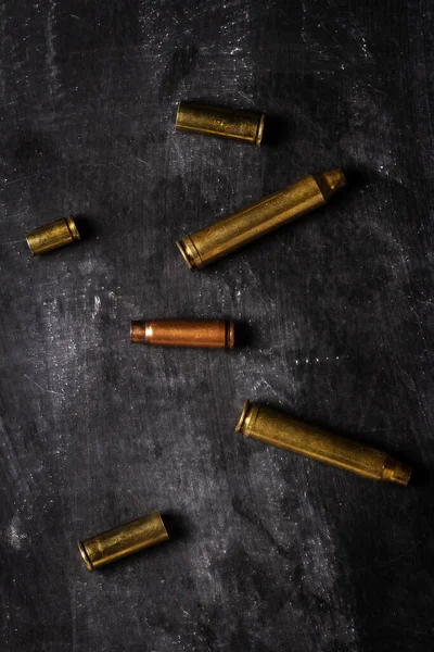 Empty Bullet Cartridges Lying Black Background Royalty Free Stock Images