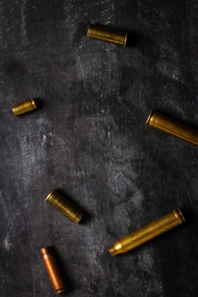 Empty Bullet Cartridges Lying Black Background Fotos De Bancos De Imagens