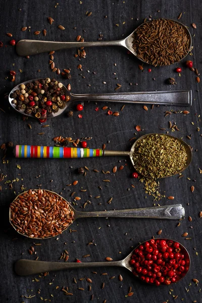 Old Spoons Various Seeds Herbs Spices Black Background Flat Lay — Stok fotoğraf