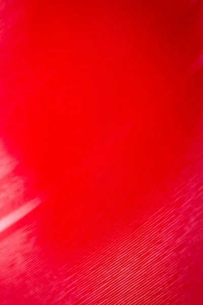 Macro shot of red color vinyl record. Surface of an old vinyl record. Shallow depth of field.