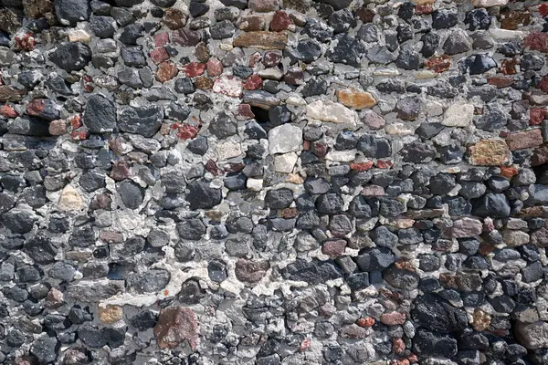 Natural dark stone wall background, natural stone texture