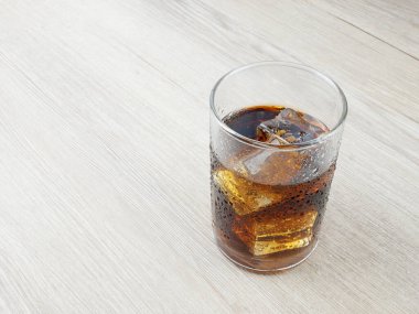 Soft drink on wooden background.