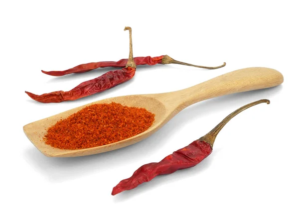 Chili powder and dried chilli in spoon on white background, cayenne pepper.