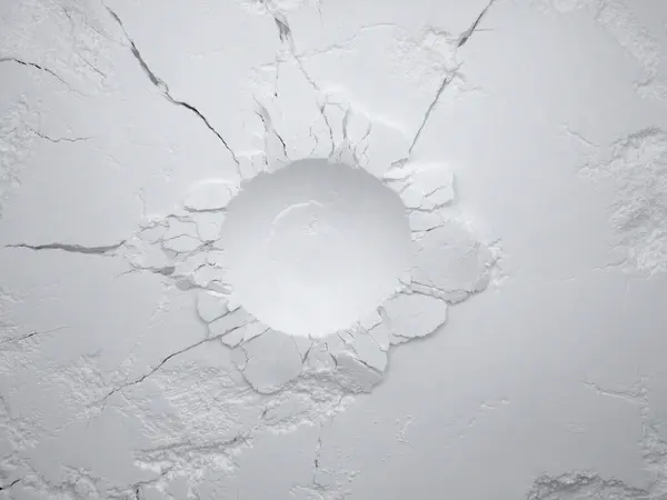 White flour texture background. Abstract powder texture. White powder surface with cracks and a round crater.