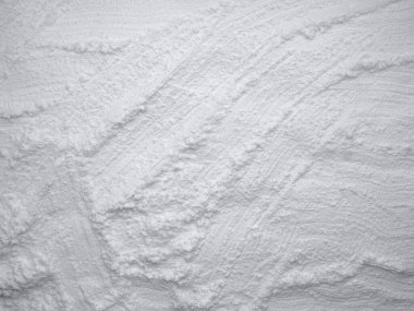 White flour texture background. Abstract powder texture. White powder surface with cracks. 