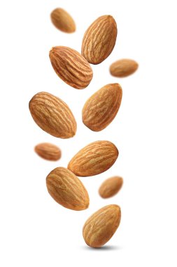 Beyaz arka planda izole edilmiş badem fıstıkları. Badem uçuşu.