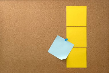 Blank sticky note paper on cork board wall. Noticeboard to organize life and work concept  clipart