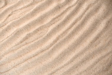 Sand waves texture background. Sand on beach as background. top view clipart