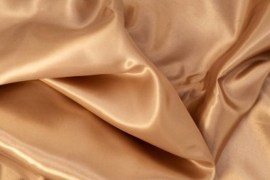 Arka plan için doğal altın kumaş dokusu. Lüks tuval arkaplanı.