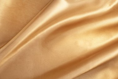 Arka plan için doğal altın kumaş dokusu. Lüks tuval arkaplanı.