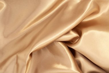 Arka plan için doğal altın kumaş dokusu. Lüks tuval arkaplanı.