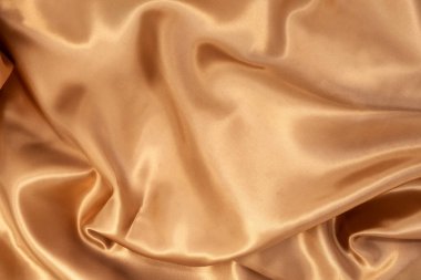 Arka plan için doğal altın kumaş dokusu. Lüks tuval arkaplanı.