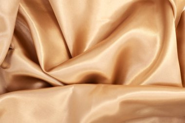 Arka plan için doğal altın kumaş dokusu. Lüks tuval arkaplanı.