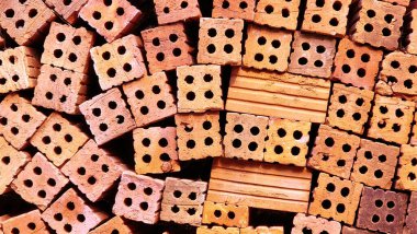 İnşaat geçmişi için kırmızı tuğla yığını. Yakın plan..