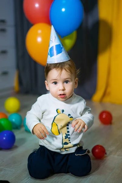 The boy's birthday. Babies First Birthday. One year old with colorful balloons.