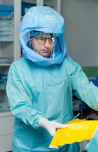Pandemic medical specialist in protective suit. Coronavirus safety for hospital workers.