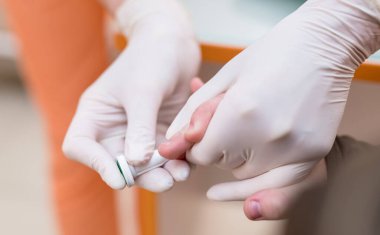 Blood collecting from finger. Hospital blood samples from hand.
