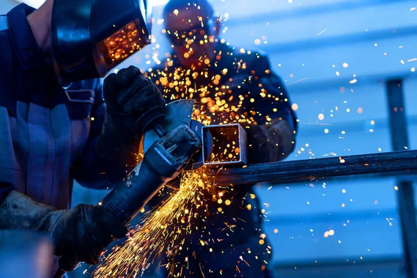Metalwork sparks in factory. Industrial engineering technologies.