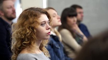 People sitting in the conference room. Audience listens to the speech of the lecturer in the conference hall