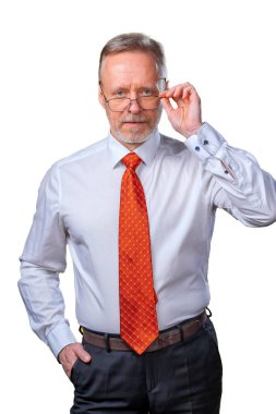 Portrait of an old man smiling, looking at camera, in studio, white background. Man in glasses portrait