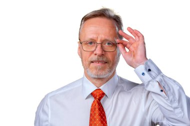 Portrait of an old man smiling, looking at camera, in studio, white background. Man in glasses portrait