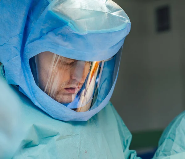 Medical protective sterile suit. Surgeon in safety uniform.