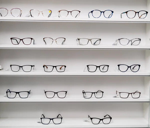 stock image Eyeglasses stand in store. Eye accessories in shopping stand.