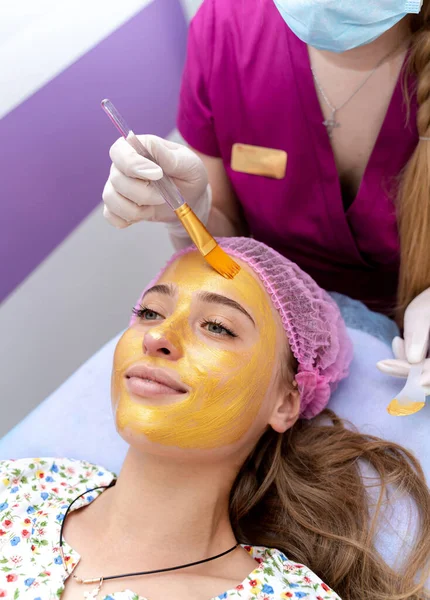 Woman beauty cosmetics procedure. Face healthcare skin therapy.