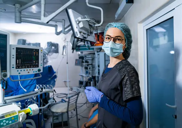 Portrait of surgery specialist in sterile mask. Professional operation assistant.