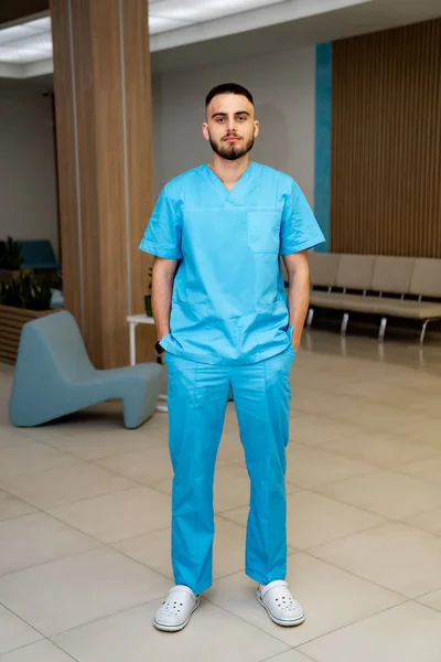 Portrait of young medical specialist. Handsome confident surgeon.