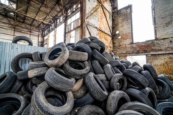 Old tires trash for recycling. Used garbage car wheels.