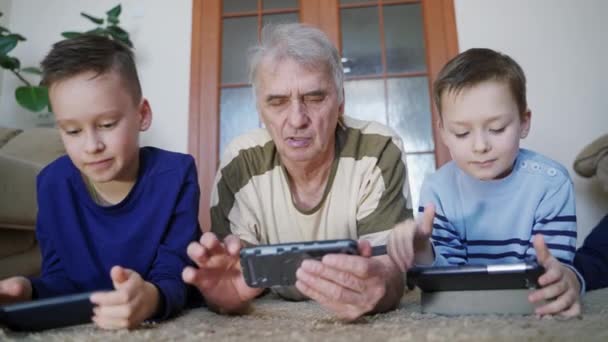 Parents Playing Phone Together Little Boys Grandfather Using Smartphone Home — Stock Video