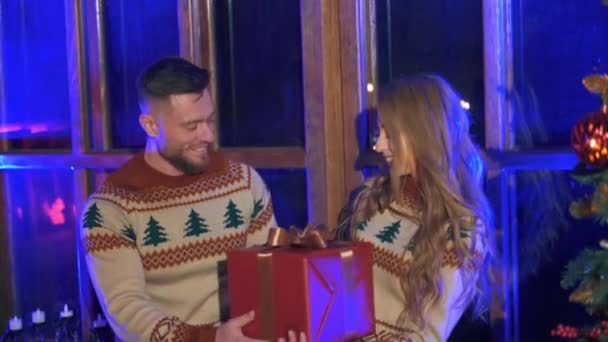 Lovely Couple Christmas Sweaters Handsome Man Giving Red Box Present — Stock Video