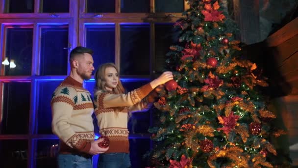 Beautiful Couple Christmas Tree Young Woman Her Husband Decorating Christmas — Stock Video