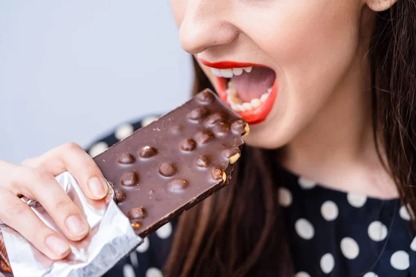 Woman Eating Chocolate Bar Her Mouth Open Indulging Sweet Pleasure — Stock Photo, Image