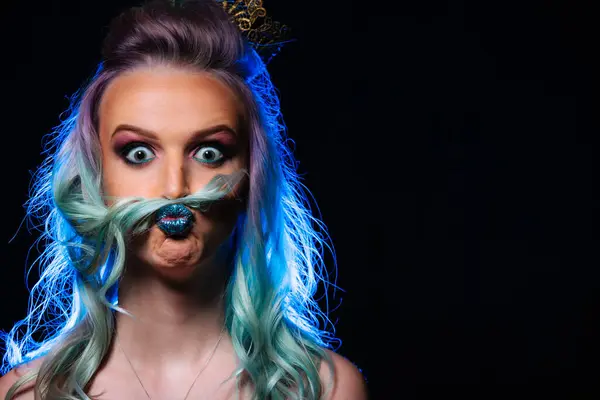A woman with blue hair and a fake mustache. The Mysterious Woman with Vibrant Blue Hair and a Disguised Fake Mustache