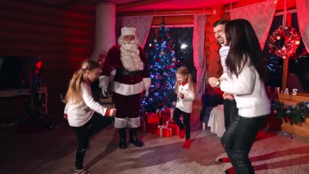 Joyful Family Playing Games Santa Claus Santa Gives Tasks Parents — Stock Video