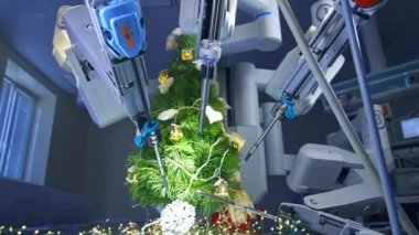 Robot kollar Noel ağacını süslemek için çevrelemiş. Modern tıbbi ekipmanlar ameliyathanede köknar ağacını süslüyor. Kusursuz manipülatörler köknar ağacının üzerine bir kar tanesi koydular..