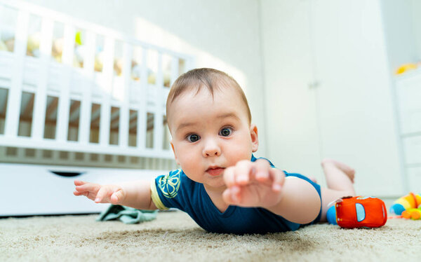 A Peaceful Baby Resting on the Floor. A baby laying on the floor in a room
