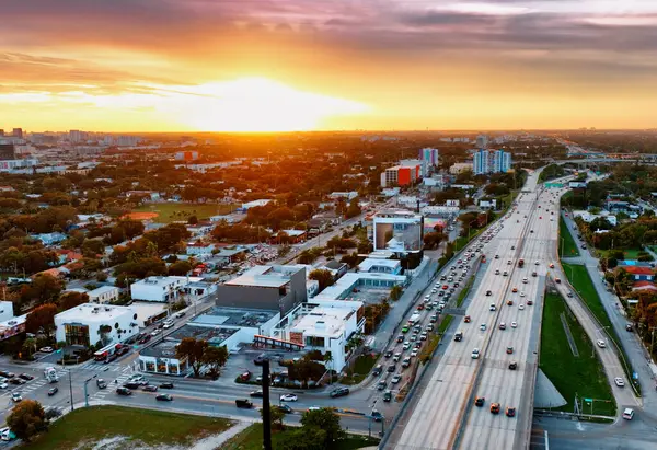 Aerial View of Miami City at Sunset. Capture the breathtaking aerial view of Miami city during a mesmerizing sunset.