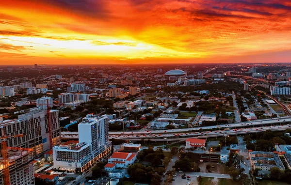 Aerial View of Miami City at Sunset. Capture the stunning beauty of Miami City from above as the sun sets.