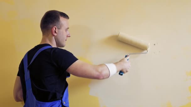 Male Worker Paint Roller Young Man Worker Suit Painting Wall — Stock Video