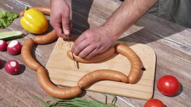 Man Cutting Sausages Grilling Chef Doing Incisions Hot Dog Sausages — Stock Video