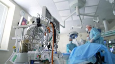 Contemporary medical system in the operating room. Monitor and machine ventilator in hospital theater. Modern equipment to show vital signs of a patient in the hospital.