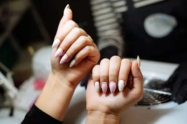 Woman With Manicured Nails, A Perfectly Polished Look for Any Occasion. Capture the essence of elegance and style with this photo showcasing a womans manicured nails.