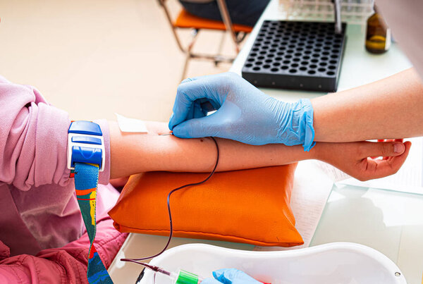 Person Wearing Gloves Engages in Activity. A person wearing gloves takes part in a task, demonstrating their dexterity and focus.