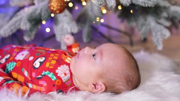 Lovely Little Child Red Clothes Lies Christmas Tree Adorable Baby — Stock Video