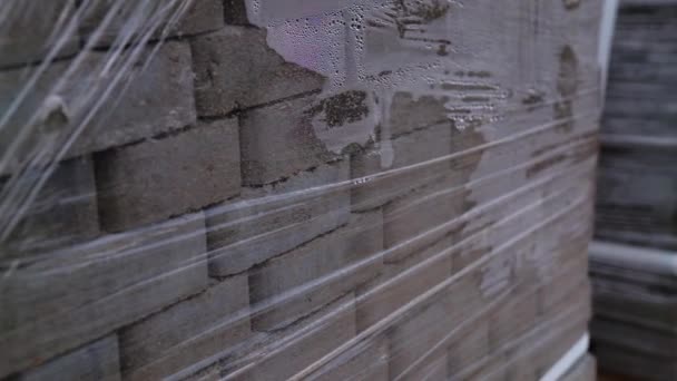 Grey Bricks Piled Pack Covered Cellophane Construction Materials Close — Stock Video