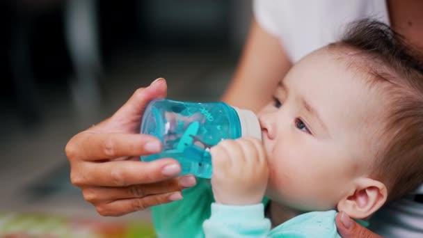 Lovely Toddler Stylish Hair Drinking Water Bottle Mom Hand Holding — Stock Video